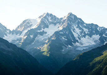 Majestic snow capped mountain range under bright sky