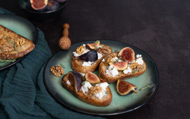 Front View of Three Fig and Goat Cheese Toasts with Honey and Walnuts