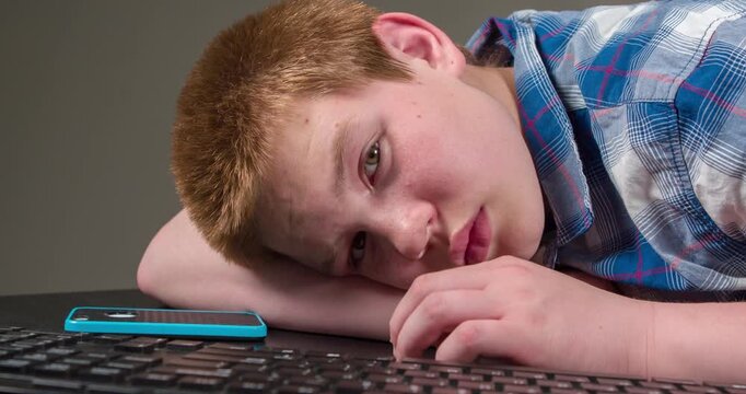 Boy surrounded by technology goes to sleep 4k