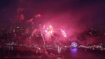 An aerial view captures vibrant fireworks illuminating the San Francisco skyline on Independence Day, showcasing a magnificent display of colors and lively celebrations that embody the holiday spirit - Powered by Adobe