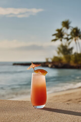 experience essence of hawaii with refreshing cocktail on sandy beach surrounded by palm trees and ocean breeze
