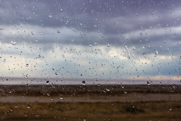 Water drops on a car glass. Raining weather