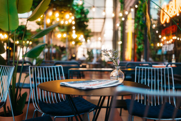 Chic Outdoor Cafe with Ambient Lighting and Stylish Decor