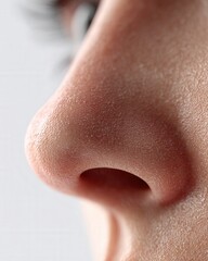 Fototapeta premium Close up of human nose skin. Detailed close up of human nose skin texture showing pores and natural surface