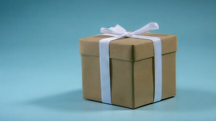 Brown gift box with white ribbon sits elegantly against a soft blue background, creating a festive atmosphere perfect for celebrations and special occasions