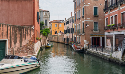 Venetian canals with boats and reflections © Dreamnordno