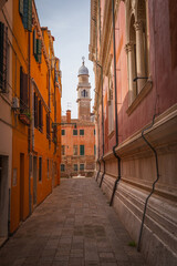 Venetian alley with view of historic bell tower