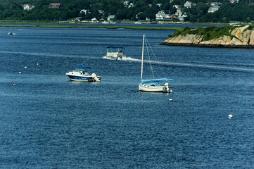 Boats Cruising Serene Coastal Harbor Sailboat, Powerboat and Houseboat
