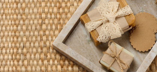 Pieces of handmade soap on a marble stand
