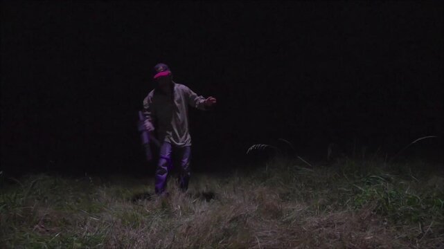 Fugitive Running from Drone Pursuit at Night in Field