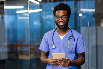 Medical professional smiling while using a tablet in a modern workplace