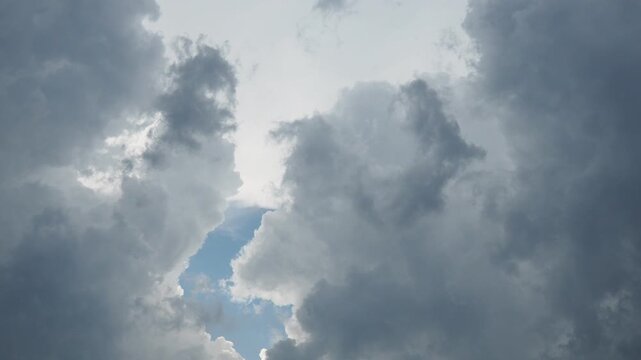 Clouds intensify and thicken, creating a dramatic backdrop as the weather shifts. The winds pick up strength, foreshadowing a stormy atmosphere. Look closely for signs of rain.