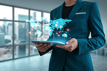 Global business network concept using tablet for international trade and communication strategy planning