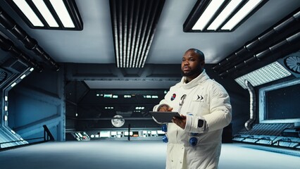 Astronaut analyzing planetary data in spacecraft powered by advanced engineering. African american starship crew member exploring deep space, doing surface research, camera A