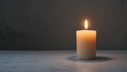Lit Candle on Plain Surface in Dim Room