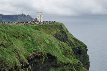 Castle on luscious green Irish cliff