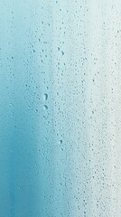Water droplets collect on a smooth surface creating a calming blue gradient effect