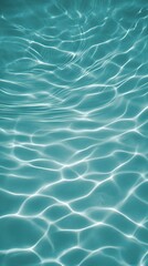 Rippling turquoise water surface reflects sunlight in a serene aquatic environment