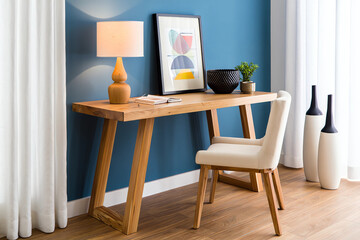 Modern wooden console table with chair and decorative items in a stylish room