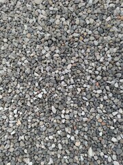Fine Grey Gravel Texture: Ideal background for construction, landscaping, or minimalist design. Durable, natural stone for paths, gardens, and drainage. Build your foundation.