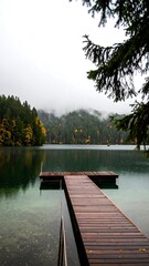 Obraz premium Calm lake with wooden dock