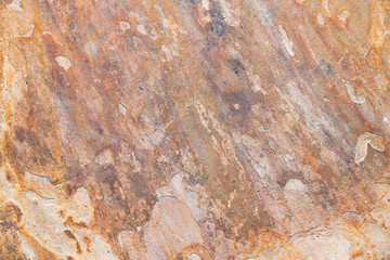Macro texture of solid rock with cracked, weathered surface, mineral structure, and earthy detail
