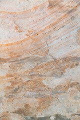 Rough stone texture with natural brown tones, grunge pattern, and cracked weathered surface