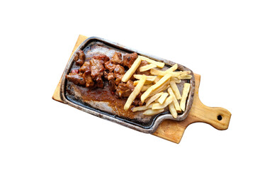 Smoked pork ribs, served on a griddle and accompanied by French fries