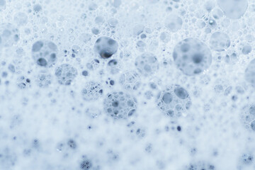 Macro shot of bond between soap bubbles as background