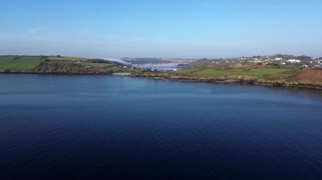 Drone Dolly Forward Towards Aqueduct in Kinsale, Ireland at Sunset Golden Hour