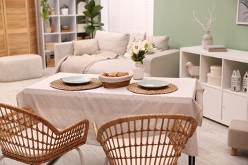 Stylish table with chairs and decor in dining room. Interior design