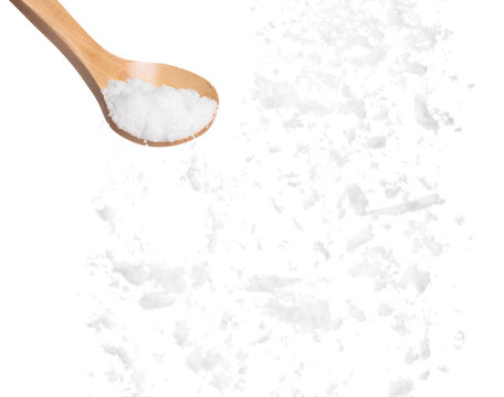 Refined Salt fall down pouring in wooden spoon, powder white salts explode abstract cloud fly. Small ground salt splash in air, food object element design. White background isolated high speed freeze