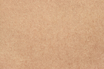 Brown cardboard sheet abstract background, texture of sepia color kraft paper with vintage pattern for design art work.