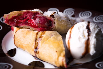 Cherry strudel with ice cream