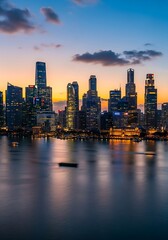 Obraz premium Singapore's shimmering skyline: Capturing the vibrant urban landscape at twilight's embrace