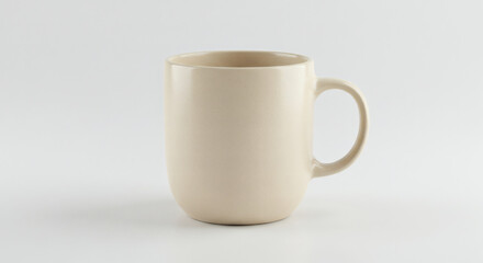 Obraz premium Simple Cream-Colored Mug Isolated on White Background
