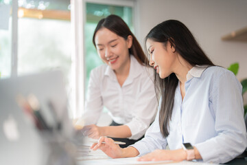 Collaboration in the Workplace: Two Women Engaging in Productive Discussion