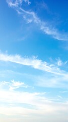 A vibrant blue sky adorned with fluffy white clouds, creating a serene and uplifting atmosphere, perfect for a sunny day outdoors.