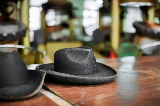 Intricate detailing of felt hat dies in a craft workshop showcasing the artistry behind hat making - Powered by Adobe