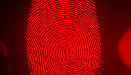 Fingerprint Pattern under Red Light: An intricate fingerprint pattern glows under a vibrant red light, symbolizing identity, security, and forensic science.