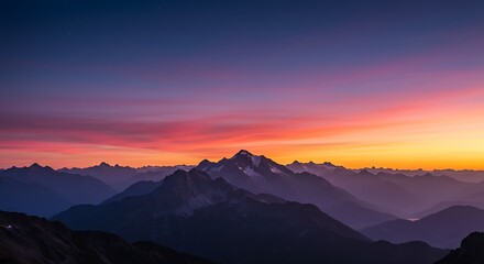 Fototapeta premium Mountain Range at Sunset with Colorful Sky and Silhouetted Peaks
