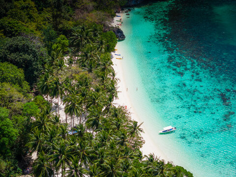 Seven commandos beach in El Nido, Palawan, Philippines islands. Aerial drone view. Top view of beautiful turquoise beach, with white sand and palms
