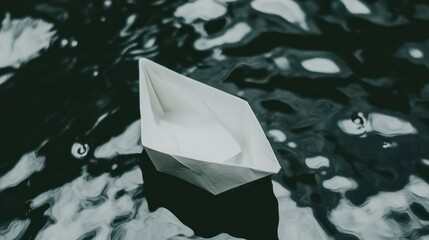 Minimalist aesthetic of a white paper boat floating on serene wavy water surface