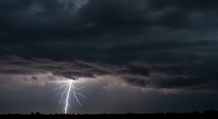Dark Storm Cloud with Bright Lightning Strike Over Landscape