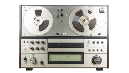Vintage audio recording machine with multiple control panels and reel-to-reel tape decks. Its neutral color scheme and design evoke a nostalgic mood.