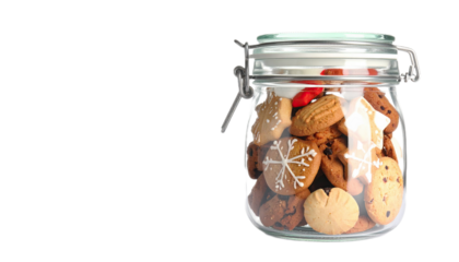 A glass jar brimming with assorted cookies, showcasing festive decorations and warm tones.