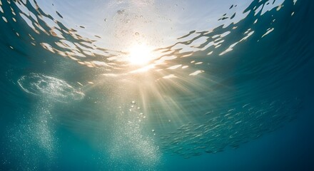 Underwater Sunlight Streaming Through Rippling Water Surface Creating Calm Serene Scene