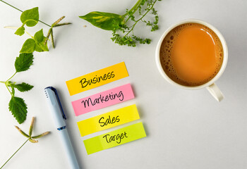 Business Strategy Notes With a Cup of Tea on Desk