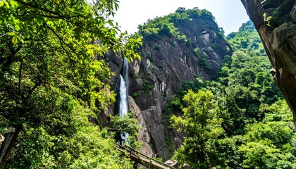 Lush waterfall cascading down rocky mountainside