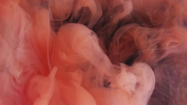 Cloud flow. Paint water. Defocused orange purple colorful ethereal wet splash liquid spreading on abstract dark black art background.